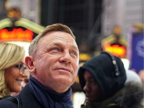 Actor Daniel Craig reacts during a promotional appearance on TV in Times Square for the new James Bond movie "No Time to Die" in the Manhattan borough of New York City, New York, U.S., December 4, 2019.
