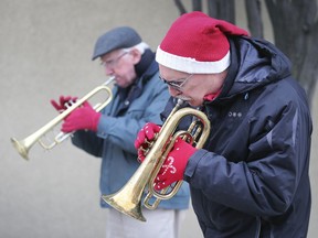 A small army of Windsor Goodfellow volunteers prepared holiday food baskets for the needy on Friday, Dec. 13, 2019. Local musicians Kevin Masterson, left, and Dave Willick provided some festive holiday tunes for the downtown event.