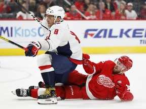 Washington Capitals left wing Alex Ovechkin draws a penalty from Detroit Red Wings defenseman Filip Hronek while scoring his third goal of the game during the third period at Little Caesars Arena. Mandatory Credit: