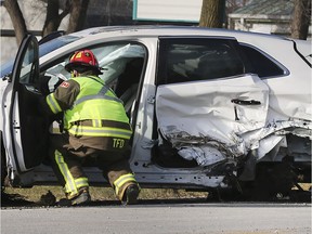 A Tecumseh firefighter checks out a vehicle involved in a serious crash on Monday, December 23, 2019, on Manning Road near Sylvestre Drive. The accident occurred at approximately 1 p.m. and required the extrication of two motorists. Injuries were not life-threatening.