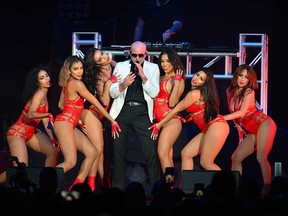 Rapper Pitbull performing with dancers in Miami, Florida, in April 2018.