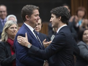 Prime Minister Justin Trudeau shakes hands with Andrew Scheer after Scheer announced he will step down as leader of the Conservatives, Thursday December 12, 2019 in the House of Commons in Ottawa.