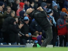 Manchester City manager Pep Guardiola celebrates after Gabriel Jesus scores their third goal in a 4-0 route of Leicester City on Boxing Day.