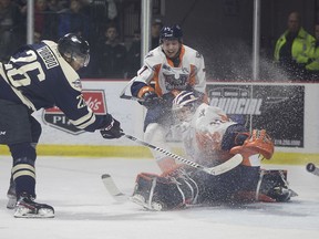 Windsor Spitfires forward Cole Purboo nets the first goal of the game on Tuesday as he puts one past Firebirds' goalie Anthony Popovic, in OHL action at the WFCU Centre.