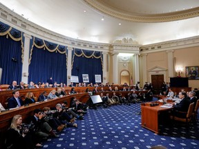 News photographers and members of the House Judiciary Committee look on as Jonathan Turley, professor of Public Interest Law at George Washington University Law School, testifies during the committee's first hearing on the impeachment inquiry into U.S. President Donald Trump on Capitol Hill in Washington, U.S., December 4, 2019.