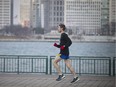 A warm end to the decade. A jogger dons mostly summer wear while out for a run along the riverfront in Windsor on Friday, Dec. 27, 2019.