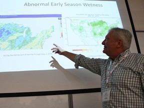 Jeff Andresen, state climatologist for Michigan and a professor at Michigan State University, points to one of the charts in the presentation he shared during the Southwest Agricultural Conference at the Ridgetown Campus of the University of Guelph on Jan. 8. (Tom Morrison/Postmedia Network)