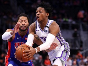 De'Aaron Fox #5 of the Sacramento Kings tries to drive past Derrick Rose #25 of the Detroit Pistons during the first half at Little Caesars Arena on January 22, 2020 in Detroit, Michigan.