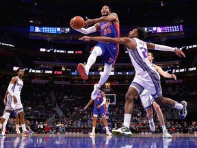 Derrick Rose of the Detroit Pistons drives to the basket past Buddy Hield of the Sacramento Kings during the second half at Little Caesars Arena on January 22, 2020 in Detroit, Michigan. Detroit won the game 127-106.