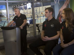 Mitch Geller, left, chief technical officer for Diving Plongeon Canada, is joined by Olympic hopefuls, Caeli McKay, and Vincent Riendeau, centre, during a press event at the Windsor International Aquatic and Training Centre, announcing Windsor will be hosting the 2020 Olympic diving trials,Wednesday  January 7, 2020.