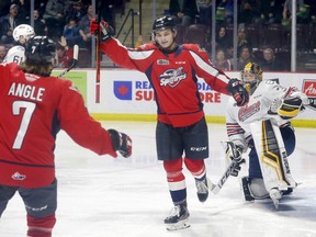 Windsor Spitfires rookie Wyatt Johnston, centre, celebrates his first-period goal against Oshawa Generals goaltender Jordan Kooy, right, in OHL action at the WFCU Centre on Thursday.