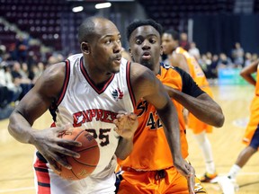 Windsor Express player Derrick Nix drives against Island Storm's Jelane Pryce in NBL Canada action from Windsor's WFCU Centre Friday.