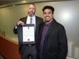 Life-saving award recipient Windsor Police Constable David Drummond, left, stands with stabbing victim Dayvon Askew-Kah, 23, following a presentation at Windsor Police Services Board meeting at Windsor Police Headquarters Thursday.  Askew-Kah has recovered from his injures and owes his life to the quick-acting Const. Drummond.