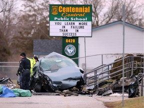 OPP collision reconstruction officers investigate a fatal accident at Comber's Centennial Central Public School Monday.  The female driver of a four-door Buick was killed when the vehicle travelling south on Taylor Avenue struck the concrete steps of the school.  No other injuries were reported.