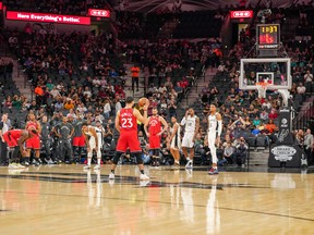 Fans cheer in honour of Kobe Bryant as the San Antonio Spurs and Toronto Raptors let the shot clock expire on each their respective first possessions during Sunday's game. (USA TODAY SPORTS)