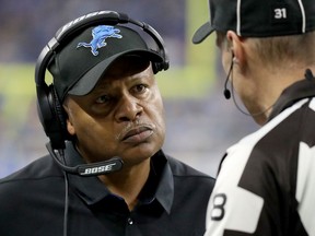 Head coach Jim Caldwell of the Detroit Lions talks with line judge Dana McKenzie during first quarter action against the Green Bay Packers at Ford Field on January 1, 2017 in Detroit, Michigan.