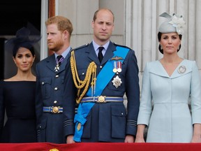 Britain's Meghan, Duchess of Sussex, left, Britain's Prince Harry, Duke of Sussex, Britain's Prince William, Duke of Cambridge and Britain's Catherine, Duchess of Cambridge, stand on the balcony of Buckingham Palace on July 10, 2018, to watch a military fly-past to mark the centenary of the Royal Air Force. Princes William and Harry on Jan. 13, 2020, put on a rare joint front to dismiss a "false story" speculating about their relationship, as senior royals met for talks about the younger brother's future. "For brothers who care so deeply about the issues surrounding mental health, the use of inflammatory language in this way is offensive and potentially harmful," they said.