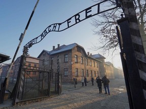 The main gate with the inscription "Arbeit macht frei" (literally in English: "work makes (one) free") at the entrance to the Auschwitz German Nazi death camp is pictured in Oswiecim, Poland, before former prisoners of the Nazi-run Auschwitz-Birkenau extermination camp on Jan. 27, 2020, to commemorate the 75th anniversary of its liberation.