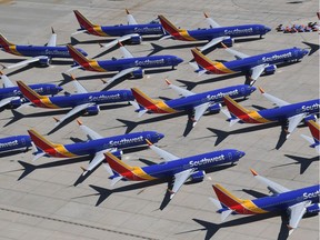 In this March 28, 2019, photo, Southwest Airlines Boeing 737 MAX aircraft are parked on the tarmac after being grounded, at the Southern California Logistics Airport in Victorville, Calif.