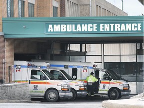A paramedic and ambulances are shown at the Windsor Regional Hospital Met campus emergency department entrance on Jan. 8, 2020.