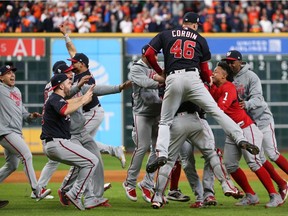 Washington Nationals players celebrate on the field after defeating the Houston Astros in game seven of the 2019 World Series at Minute Maid Park on Oct. 30, 2019. The Washington Nationals won the World Series winning four games to three.