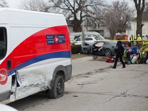 Damage is visible on a Canada Post vehicle after it was struck by a Ford Mustang on Sandwich Street in Windsor's west end on Jan. 30, 2020.
