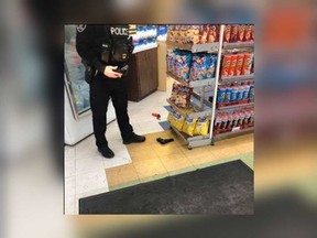 A photo taken by a member of the public reportedly at the Ottawa Variety store at 1710 Ottawa St. in Windsor on Jan. 8, 2020. A black pellet gun and an orange flare gun are visible on the floor - dropped by a robber.