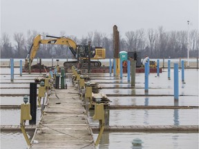 Work to replace the docks at Lakeview Park Marina takes place, Tuesday, Jan. 14, 2020.