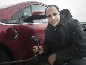 Incentive to go green. Pino Mastroianni, president of the Electric Vehicle Society —Windsor chapter, is shown Friday, Jan. 24, 2020, with his 2012 Chevy Volt at the Devonshire Mall charging station.