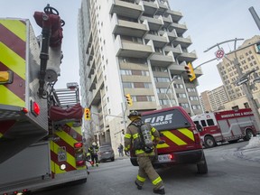 Fire crews work at the scene of a high rise fire at 380 Pelissier Street on Jan. 22, 2020.