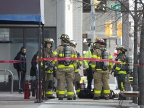 Fire crews work at the scene of a high rise fire at 380 Pelissier St., Wednesday, January 22, 2020.