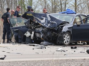 Ontario Provincial Police officers investigate the scene of a head-on collision on Highway 3 east of Walker Road on April 26, 2017. Four people involved sustained serious injuries and two were arrested.