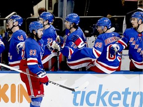 Rangers center Mika Zibanejad (93) is congratulated after scoring a goal against the Detroit Red Wings during the third period at Madison Square Garden.