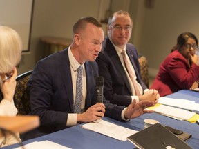 Chris Busch, centre, speaks during a panel discussion on the issue of international students at post secondary institutions at the University of Windsor, Thursday, January 23, 2020.