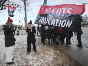 Public high school teachers and support staff participate in a one-day strike in front of Kennedy Collegiate in Windsor on Jan. 8, 2020.