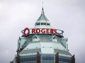 A sign is pictured on top of the Rogers Communications Inc. building on the day of their annual general meeting for shareholders in Toronto, April 21, 2015.