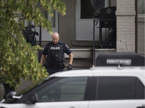 An officer with the Windsor Police Service forensics unit exits a home in the 900 block of Windsor Avenue on  Sunday, June 18, 2017.  Police arrested a male after reports of shots fired the previous afternoon.