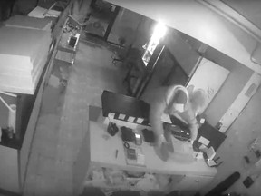 An image from a security camera video showing a break-in thief stealing the cash register from Tecumseh Pizzeria in the 1600 block of Lesperance Road on Jan. 14, 2020.
