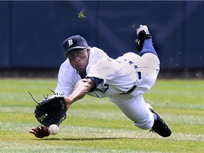 Detroit Tiger centre fielder Curtis Granderson makes a diving attempted at a  catch Monday during the home opener against the Chicago White Sox.