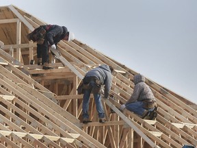 Construction workers are shown framing a house on Wednesday, Jan. 22, 2020, on Mountbatten Crescent in Windsor.