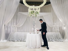 The local health unit is clarifying proof of vaccination requirements for weddings and funerals after receiving a flood of questions from confused residents. Here, Tim Hughes of Crystalove Luxury Designs is shown Jan. 11, 2020, at the company's display area during the 20th anniversary edition of the Wedding Odyssey event at the Ciociaro Club in Windsor.