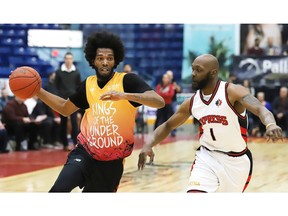 Marlon Johnson, left, of the Sudbury Five, is defended by Quinnel Brown, who returned to join the Windsor Express on Thursday.