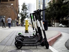 Electric scooters in a city available for rent.
