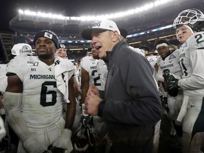 Head coach Mark Dantonio of the Michigan State Spartans celebrates with his players after defeating the Wake Forest Demon Deacons in the New Era Pinstripe Bowl at Yankee Stadium on December 27, 2019 in the Bronx borough of New York City. Michigan State Spartans won 27-21.