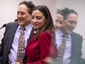Rep. Alexandria Ocasio-Cortez and Rep. Andy Levin hold a press conference about their new bill called the EV Freedom Act on Capitol Hill on February 6, 2020 in Washington, DC. The EV Freedom Act is a plan to create a nation wide charging infrastructure for electric vehicles.