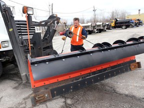 Lucio Ruccolo, who works for the City of Windsor's public works department, prepares a snow plow on Feb. 4, 2020.