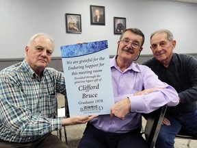Brentwood executives Dan Martin, left, Mark Lennox and Rob Smith will be mounting a Clifford Bruce plaque for his generous donation to the recovery home Tuesday.