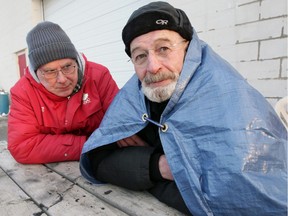 Windsor Residence for Young Men directors Brian Worrall, left, and Greg Goulin participate in the Rough Night Out fundraising event Friday. The event tries to mimic in some ways "sleeping rough," how a homeless person would have to find a place to rest overnight, in any weather.