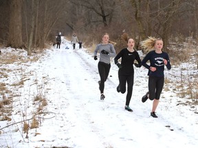 Massey Secondary School runners, right, go for a run in Spring Garden natural area in this file photo from February 2020.