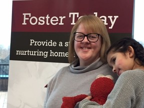 Adoptive parent Anne Klassen and daughter Ella, 4, attend a press event at the CAS offices in Windsor on Tuesday, February 11, 2020.